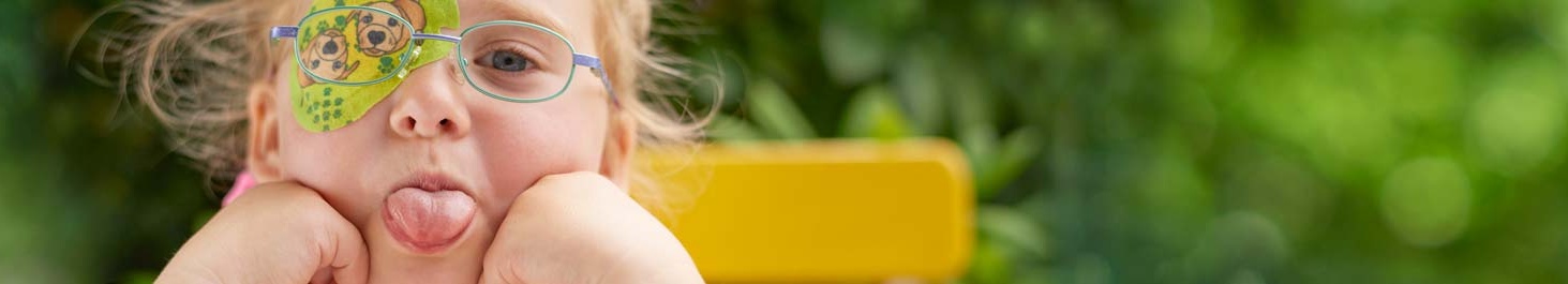 Entête Fille avec cache oculaire ORTOPAD® « Chiens », sort la langue