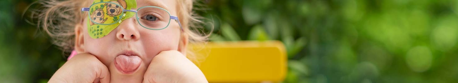 Entête Fille avec cache oculaire ORTOPAD® « Chiens », sort la langue
