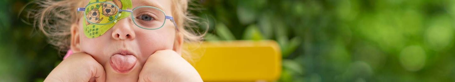 Entête Fille avec cache oculaire ORTOPAD® « Chiens », sort la langue